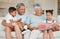 Let love be genuine. grandparents bonding with their grandchildren on a sofa at home.