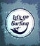 Let\'s Go Surfing Circle Icon with Surfer in a Grungy Background