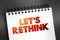 Let\\\'s Rethink text on notepad, concept background