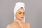 Let the skin breathe. moisturizing skin. cosmetology. young woman in terry towel use patch.