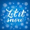 Let is snow calligraphy hand lettering on blue background with bokeh and snowflakes. Christmas, New Year and winter holidays