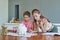 Let them be as creative as they want to. two adorable little siblings painting together at home.