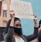 Let us choose. Cropped shot of an attractive young woman holding up a sign protesting against the covid 19 vaccine with