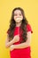 Lets be funny. party elements. happy childhood. small kid yellow background. cheerful child with beautiful long hair