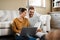 Lets check our credit score. a young couple using a laptop while relaxing at home.