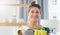 Lets clean up this mess. Closeup shot of a young woman holding a bucket with cleaning supplies at home.