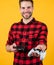 lets play together. computer game. young handsome guy in checkered shirt. stylish male wear casual clothes. bearded man