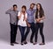 Lets put some humor into it. Studio shot of a group of diverse young people against a gray background.