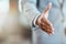 Lets shake on that negotiation. Closeup shot of an unrecognizable businessman extending a handshake in an office.