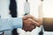 Lets shake to that agreement. Closeup shot of two unrecognizable businesspeople shaking hands in an office.