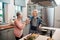 Lets toast to the love that keeps us going. a couple making a toast while cooking in the kitchen.