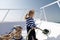 Lets travel around world. Baby boy enjoy vacation cruise ship.Boy adorable sailor shirt yacht travel around world. Child