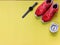 Lets wake up and excercise.Top view image with copy space of flat lay sport accessories on yellow background , sneakers ,smart