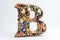 letter b, bejeweled, on white background