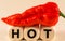 Letter block in word HOT with red chili