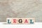 Letter block in word legal on wood background