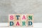 Letter block in word standard on wood background