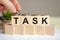 letter block in word task on wood blocks