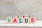 Letter block in word on wood background with coin stack in up trend Concept for profit, sale, value is growing or business
