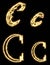 Letter C. Alphabet made by sparkler. Isolated on a black background.