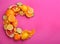 Letter C made with citrus fruits on pink as vitamin representation, flat lay. Space for text