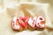Letter cookies for Valentine`s day or for a wedding day on the background of coarse calico fabric.