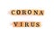 The letter corona Virus is on a wooden block on a white