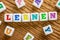 Letter dice on a wooden background - Learn - Lernen German