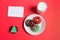 Letter, Donuts cookies and glass of milk for Santa on red background, concept Christmas and holiday.