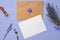 Letter envelope on lavender wooden background, copy space