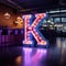 A letter k with block shape in neon lights