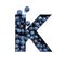 Letter K of English alphabet made of blueberries and paper cut isolated on white. Bilberry typeface