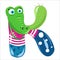 Letter K in the form of a colorful crocodile in a vest and blue pants.