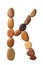 Letter K made of marine small pebbles, top view. Alphabet made of stones Isolated