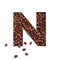 Letter N of English alphabet made of coffee beans and paper cut isolated on white. Typeface for store