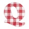 Letter Q - Red checkered napkin background - Top view