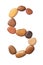 Letter S made of marine small pebbles, top view. Alphabet made of stones Isolated