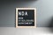 Letterboard with acronym NDA for NON DISCLOSURE AGREEMENT