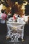 A lettering `Candy Bar` stands behind a table with sweets