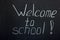 Lettering on the chalk board welcome to school