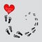 Lettering `Follow your heart` with footprints.