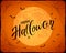 Lettering Happy Halloween on orange grunge background with Moon