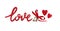 Lettering Â«loveÂ» and red hearts from wood with wedding rins and satin bow