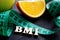 Letters BMI body mass index with measuring tape