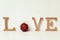 Letters and christmas bauble forming the word love