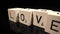 Letters on cubes write the word Love