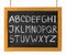 Letters of English alphabet capital on blackboard