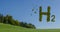 letters with green leaves hydrogen h2 on a hilly_green meadow