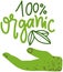 Letters of inscription, lettering 100 organic above hand. Proper nutrition, eating healthy food