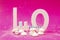 Letters L and O with marshmallows and blue straw on a pink background